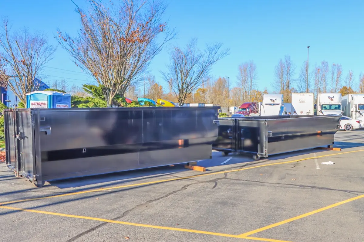 Professional dumpster rental service with roll-off container on residential driveway in Seagoville